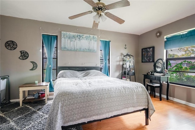 bedroom featuring ceiling fan and wood-type flooring