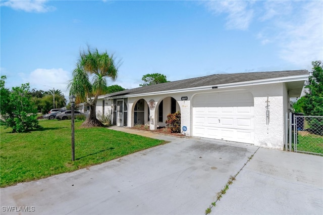 ranch-style home featuring a front yard and a garage