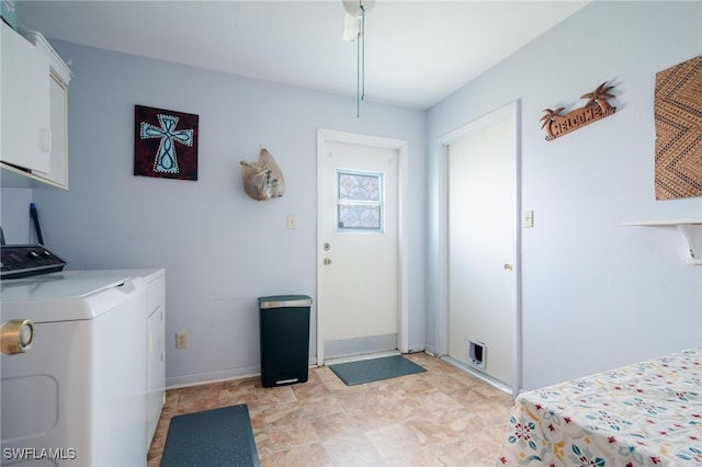 laundry room featuring cabinets and separate washer and dryer