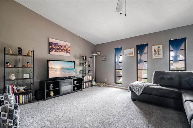 living room featuring carpet, vaulted ceiling, and ceiling fan