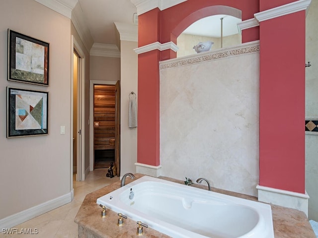 bathroom with a bathtub, crown molding, and tile patterned floors