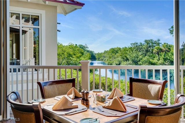 balcony featuring a water view