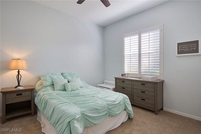 bedroom featuring ceiling fan and light colored carpet