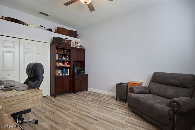 office area featuring light wood-type flooring and ceiling fan