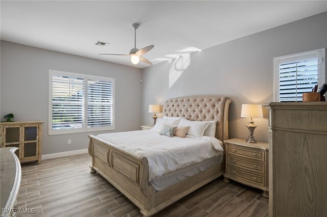 bedroom with ceiling fan and hardwood / wood-style flooring