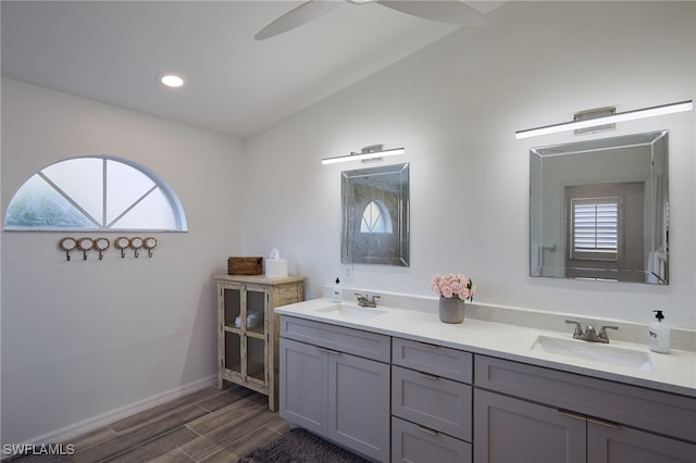 bathroom with a wealth of natural light, ceiling fan, hardwood / wood-style floors, and vanity