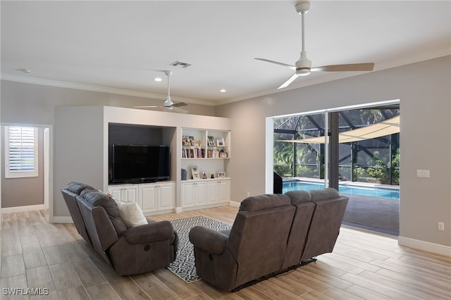 living room with light hardwood / wood-style flooring, ceiling fan, and a healthy amount of sunlight