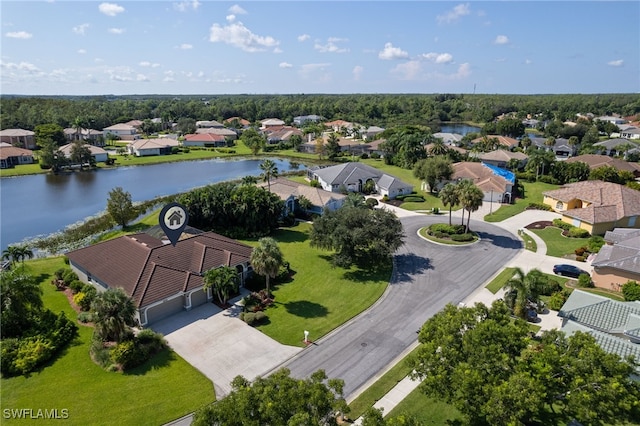 birds eye view of property with a water view