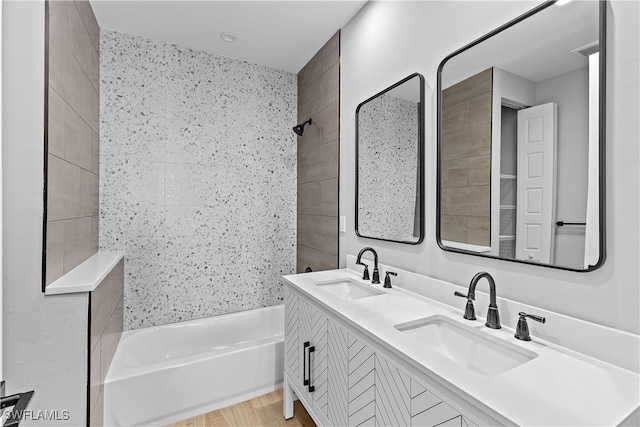 bathroom with a bathtub and vanity