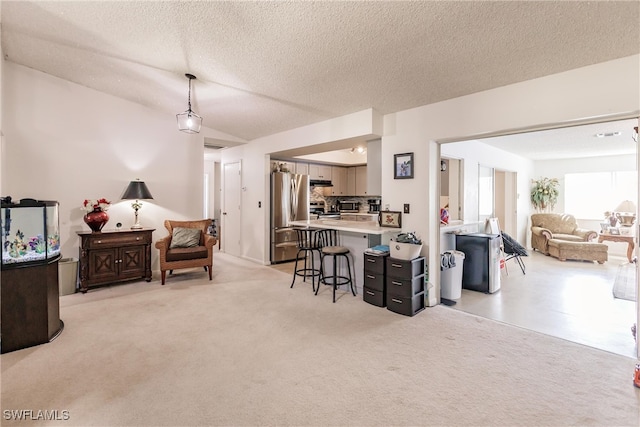 interior space with vaulted ceiling and a textured ceiling