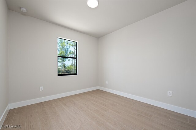 empty room with light hardwood / wood-style floors