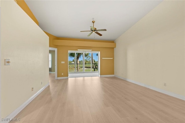 unfurnished room with light wood-style flooring, baseboards, and a ceiling fan