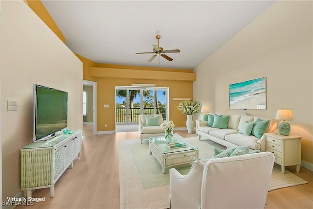 living room featuring light hardwood / wood-style floors and ceiling fan