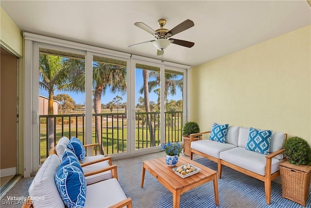 sunroom featuring a ceiling fan