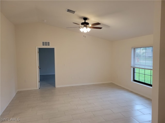 empty room with lofted ceiling and ceiling fan