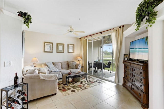 living room with ceiling fan and light tile patterned flooring