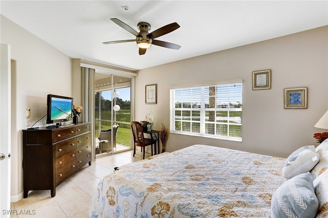 bedroom with access to exterior, ceiling fan, and light tile patterned flooring