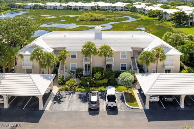 birds eye view of property with a residential view and a water view