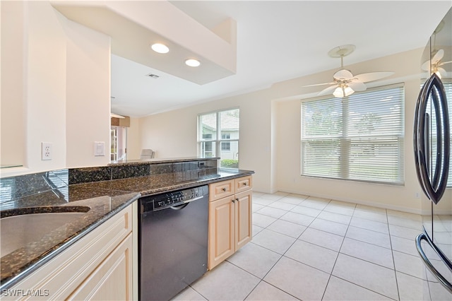 kitchen with black dishwasher, ceiling fan, light tile patterned floors, and dark stone counters