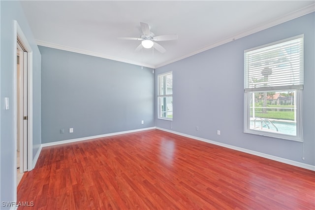 spare room with ornamental molding, wood-type flooring, and ceiling fan