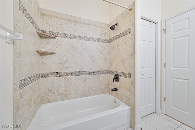 bathroom with tiled shower / bath combo and tile patterned flooring