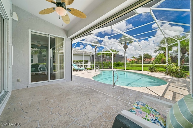 view of pool with a lanai, a patio, and ceiling fan