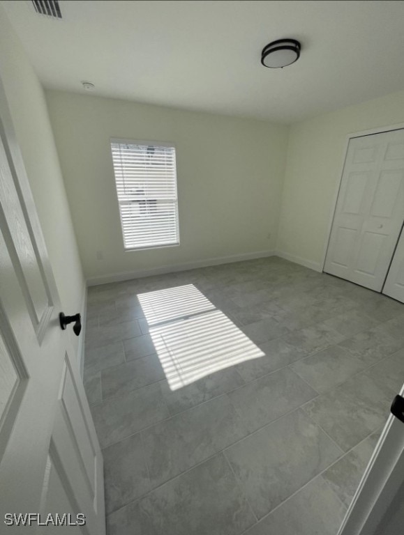 unfurnished bedroom featuring a closet