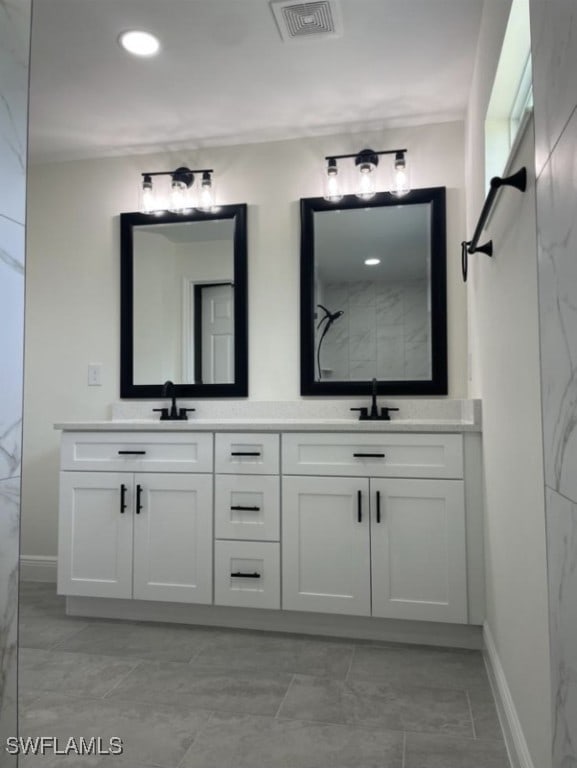 bathroom featuring walk in shower and vanity