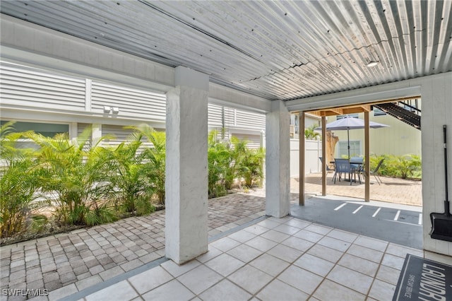 doorway to outside featuring light tile patterned floors