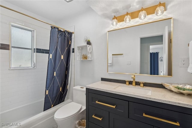 full bath with vanity, toilet, and shower / bath combo with shower curtain