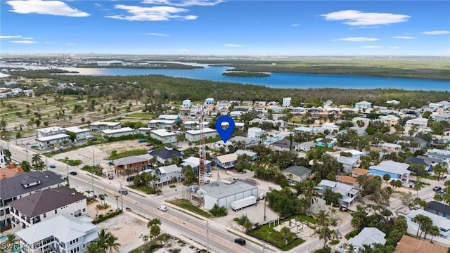 birds eye view of property featuring a water view and a residential view