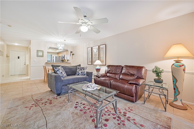 living room featuring ceiling fan and light tile patterned floors