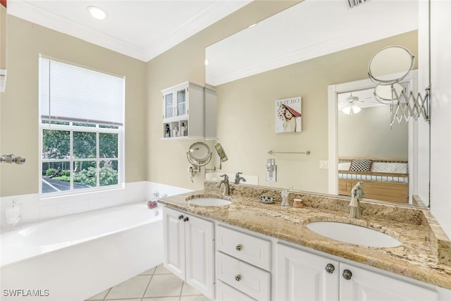 bathroom featuring crown molding, a sink, a bath, and tile patterned floors