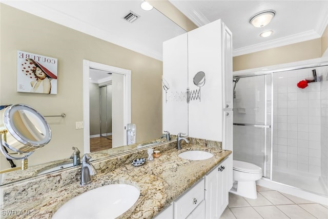 full bathroom featuring tile patterned flooring, ornamental molding, and a sink