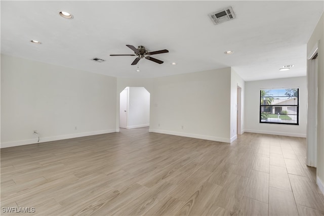 unfurnished living room with light wood-type flooring and ceiling fan