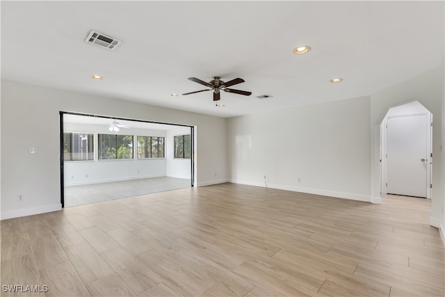 unfurnished room with light hardwood / wood-style flooring and ceiling fan