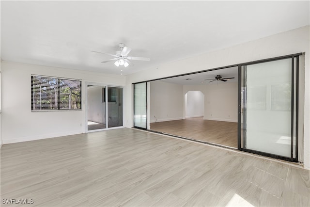 interior space with light wood-type flooring, a closet, and ceiling fan