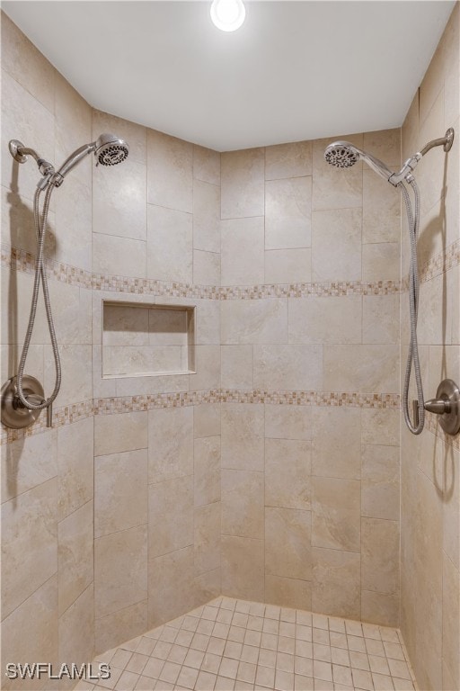 bathroom with tiled shower