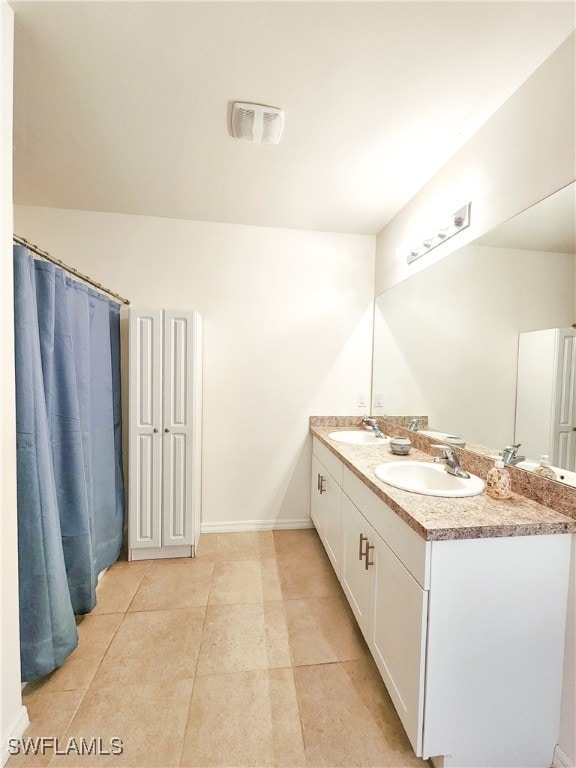 bathroom featuring vanity and tile patterned flooring