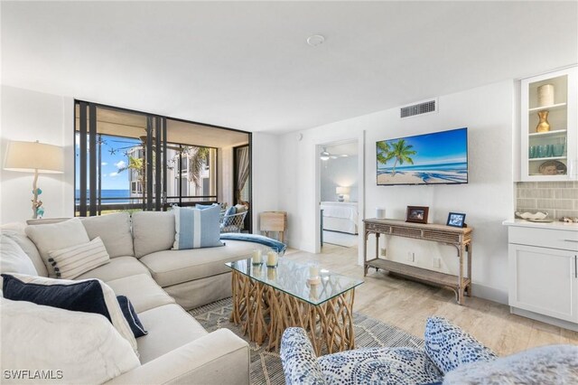 2777 W Gulf Dr Unit 109, Sanibel, FL 33957 - living room featuring light wood-style floors