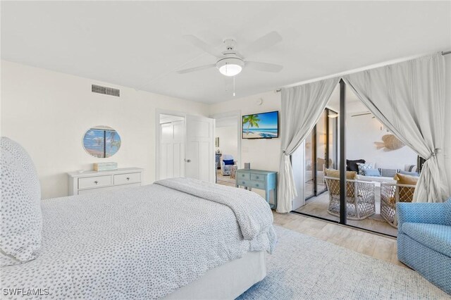 2777 W Gulf Dr Unit 109, Sanibel, FL 33957 - bedroom with wood finished floors and ceiling fan