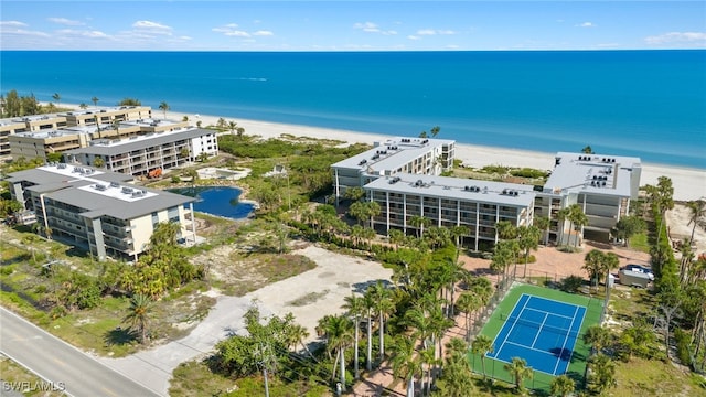 drone / aerial view with a water view and a view of the beach