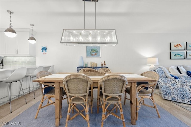 2777 W Gulf Dr Unit 109, Sanibel, FL 33957 - dining room with light wood-style floors