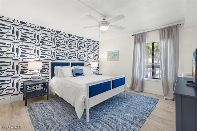 2777 W Gulf Dr Unit 109, Sanibel, FL 33957 - bedroom featuring baseboards, wood finished floors, and a ceiling fan