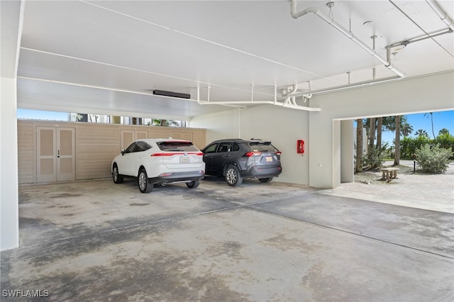 garage featuring a carport