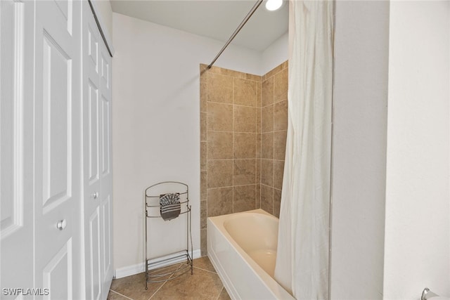 bathroom with tile patterned flooring and shower / bath combo with shower curtain