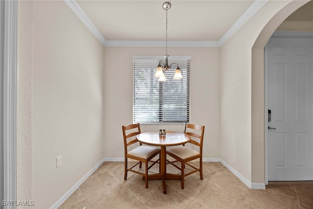 tiled dining area with a notable chandelier and crown molding