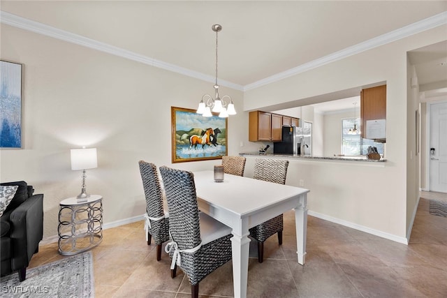 dining space featuring light tile patterned floors, ornamental molding, and a chandelier