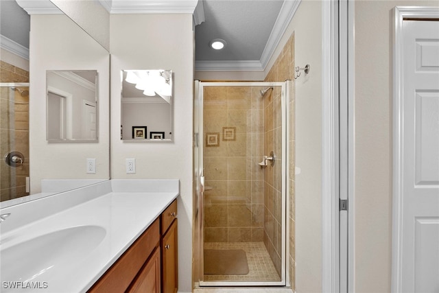 bathroom featuring crown molding, vanity, and an enclosed shower