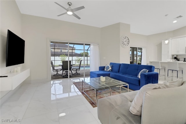 living room featuring ceiling fan